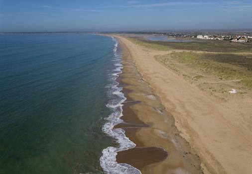 beach at the edge of the campsite Les Tulipes in the seafront with direct access beach next to la tranche sur mer 